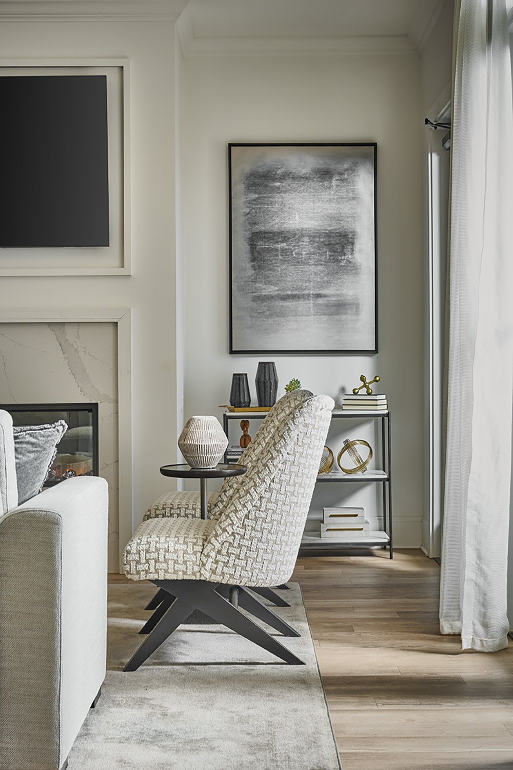 living room armless chairs and art