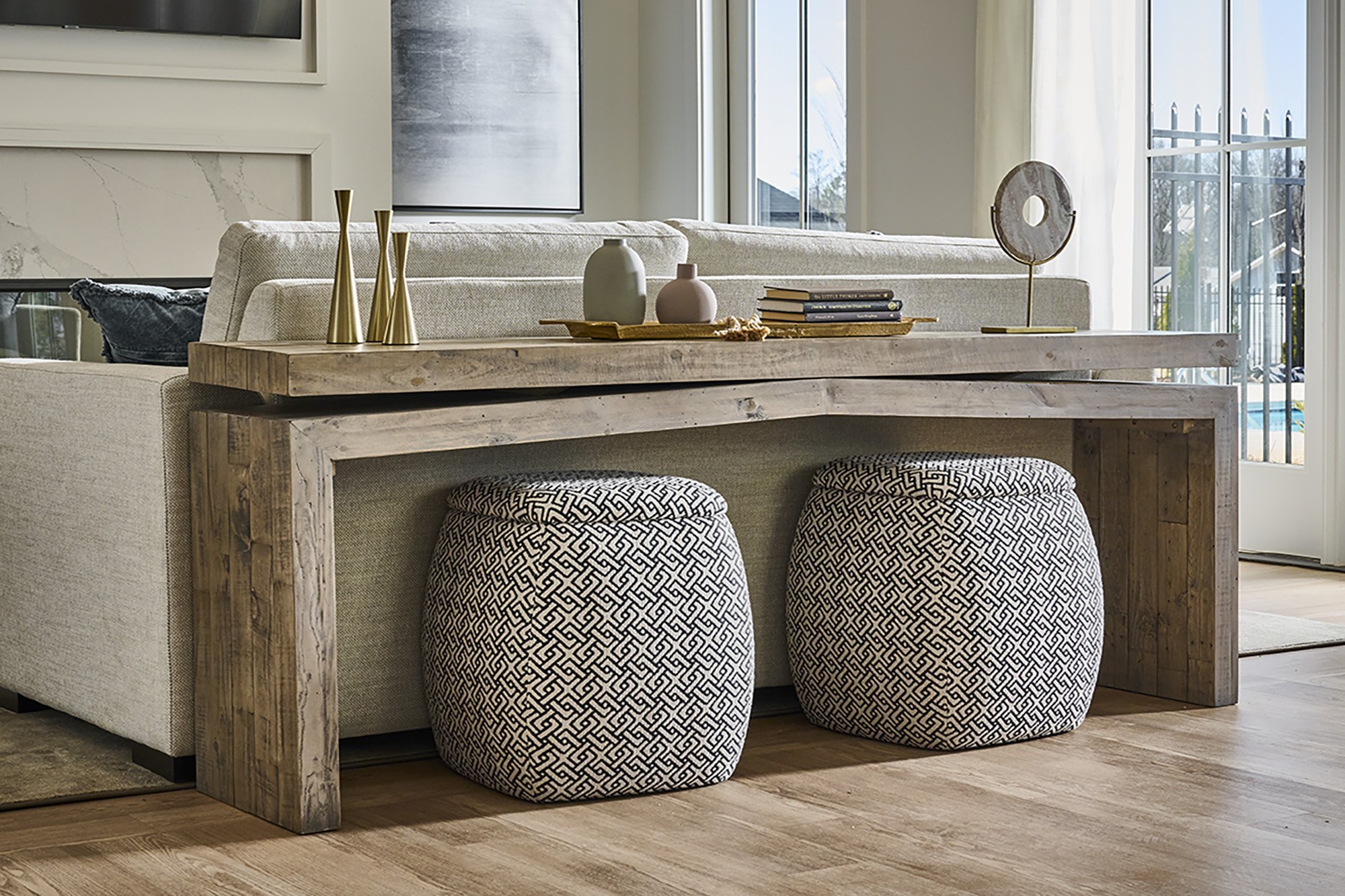 living room detail with console table and ottomans